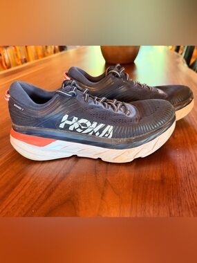 Hoka Women's Bondi Navy Running Shoes with White Logo and Orange Accent